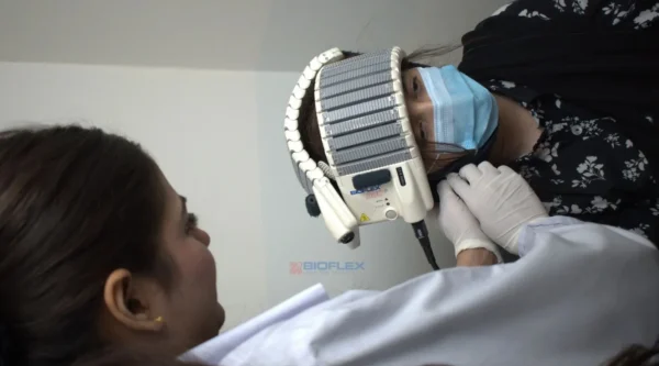 female doctor performing laser therapy