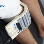Low-level laser therapy session for knee pain at a clinic in Pakistan