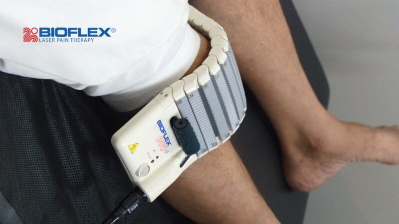 Low-level laser therapy session for knee pain at a clinic in Pakistan